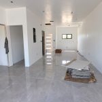 unfinished-modern-interior-with-glossy-tile-floors.jpeg